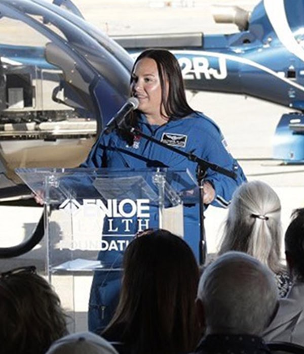 Searle Starter woman speaking at the Board of Directors event, showcasing leadership and innovation in aerospace technology.
